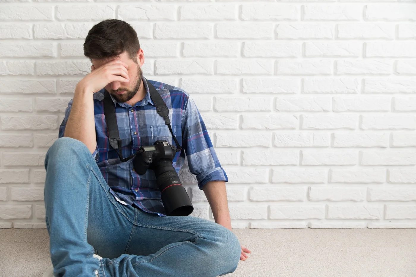 upset photographer trying to figure out what to start as a new photographer
