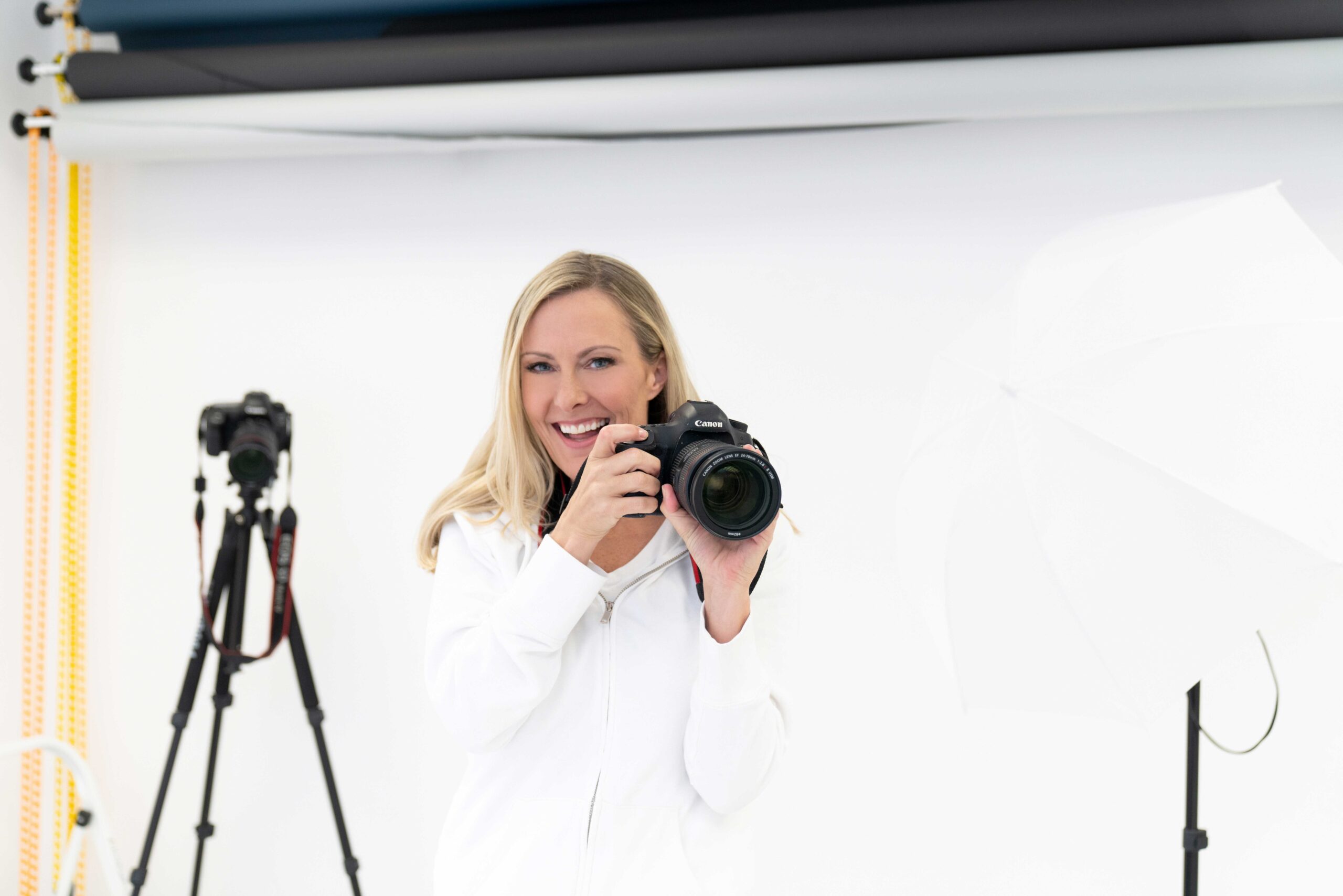 Photographer and coach Jane Goodrich with camera in studio