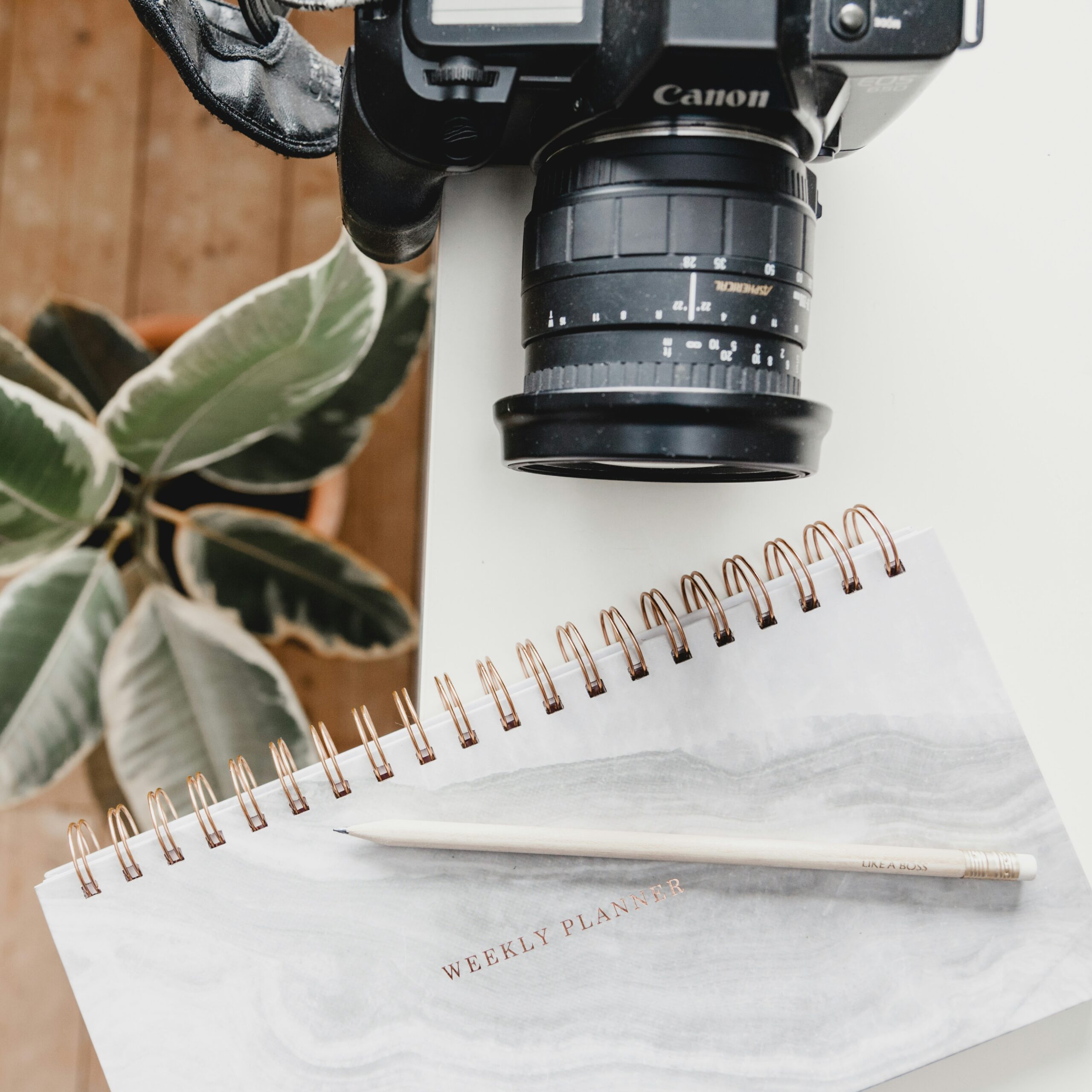 desk with DSLR camera and 3-day marketing challenge for photographers